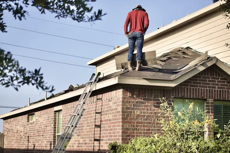 Professional roofer working on a residential roof in Rancho Encantada